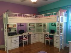 a white loft bed with desk underneath it