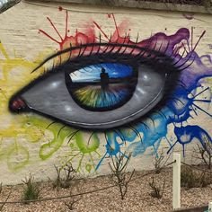 an eye painted on the side of a building