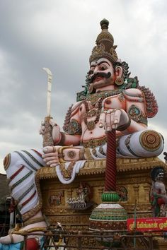 an elaborately decorated statue in the shape of a hindu god