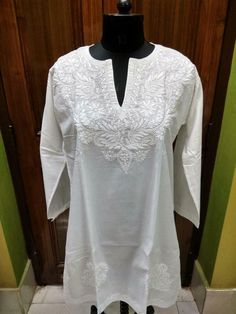 BEAUTIFUL 100% COTTON RARE TUNIC SHIRT ETHNIC CHIKAN HANDMADE EMBROIDERY TOP KURTA KURTI FREE SHIP COUNTRY OF MANUFACTURE INDIA MAKER  KINSLEY KRAFT   FEATURES WE ARE EXPORTERS OF ALL KINDS FASHION EXCLUSIVE ETHNIC GARMENTS GREAT PRICES GREAT CHOICE FOR ALL WITH FANCY CHIKAN EMBROIDERY * 100% Fancy Hand Embroidered CHIKAN work is only done in our town Lucknow, India. From our town this artwork is sent to the world.  All my Items are Made in a pet free and smoke free environment.   At "KINSLEY KR Chikan Tops Cotton, White Embroidered V-neck Kurta, Traditional V-neck Tops With Intricate Embroidery, White V-neck Festive Kurta, V-neck Cotton Kurta With Resham Embroidery, Traditional V-neck Kurta With Chikankari Embroidery, Free Size White Traditional Kurta, Traditional White Free Size Kurta, White Free Size Traditional Kurta