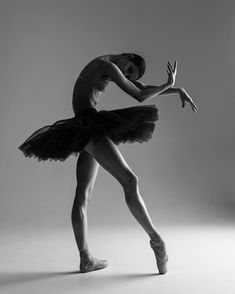 a black and white photo of a ballerina