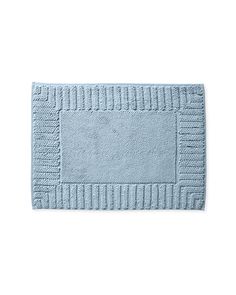 a blue bath mat on a white background