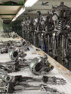 an assembly line with many metal objects on it