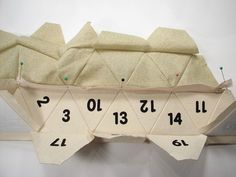 an origami boat with numbers on it