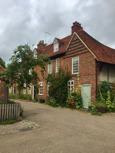 an old brick building with ivy growing on it