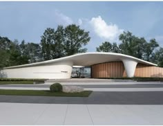 an architectural rendering of a curved building with trees in the background