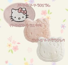 two hello kitty hair clips are shown on a flowered background with the word hello kitty written in japanese