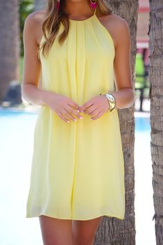 This dress rocks a classic A-line shape in a summer-ready worthy color! Dress is lined and has a button keyhole detail in the back. $38.00 Dressy A-line Mini Dress For Summer, Elegant Yellow Sleeveless Dress For Vacation, Dressy Sleeveless Cocktail Dress For Summer, Elegant Beach Dress With Keyhole Back, Elegant Keyhole Back Beach Dress, Elegant Flowy Dresses For Summer Parties, Elegant Mini Dress For Summer Parties, Elegant Yellow Mini Dress For Beach, Elegant Summer Mini Dress With Keyhole Back