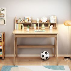 a child's room with a soccer ball on the floor and bookshelves