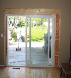 an open sliding glass door in a living room