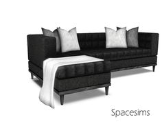 a black and white couch with pillows on it