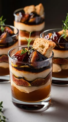 three desserts in small glass dishes on a table