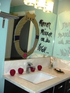 a bathroom with a mirror, sink and writing on the wall above it that says moot night at my mom