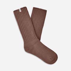 Made from a soft rib knit and crafted with Responsible Cotton, the Tyla Slouchy Crew sock is designed for a slouchier fit. | Slouchy Cotton sock. 97% Cotton/2% Recycled Polyester/1% Elastane. Made from Responsible Cotton. 11 inch height. Soft twill tape with The UGG® Logo on top cuff. Fits shoe size: 5-10. Imported. | UGG® Women's Tyla Slouchy Crew Sock Cotton Blend Socks in Allspice Casual Cable Knit Knee-high Socks, Casual Knitted Solid Color Socks, Casual Solid Knitted Socks, Brown Knitted Socks For Fall, Comfortable Brown Mid-calf Socks, Brown Socks For Fall Stocking Stuffer, Comfortable Soft Brown Socks, Cozy Soft Brown Socks, Casual Brown Knee-high Socks For Fall