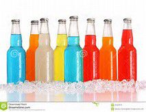 a row of bottles filled with different colored drinks