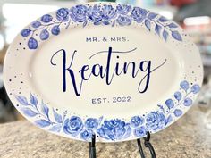 a blue and white plate with the words, mr & mrs keeting on it