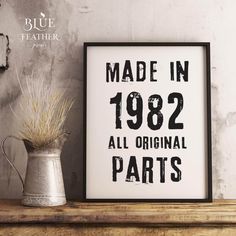 a framed sign that says made in 1932 all original parts on the shelf next to a potted plant