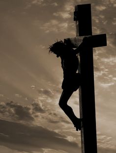 a person climbing up the side of a cross with a quote above it that reads, there's no greater love than this