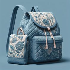 two pieces of blue and white quilted backpacks with floral designs on the front