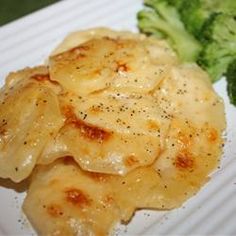 broccoli and ravioli on a white plate