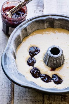 a cake pan filled with batter and jelly