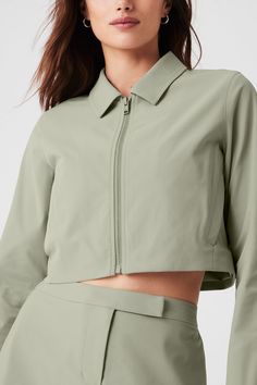 Cropped High Speed Jacket - Limestone Spring Casual Alo Yoga Outerwear, Alo Yoga Casual Spring Outerwear, Casual Alo Yoga Spring Outerwear, Alo Yoga Long Sleeve Spring Outerwear, Fitted Solid Cropped Jacket With Pockets, Fitted Cropped Jacket With Pockets, Alo Yoga Fall Outerwear For Work, Alo Yoga Fall Workwear Outerwear, Alo Yoga Long Sleeve Workwear Outerwear