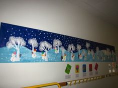 a wall hanging with snowmen and trees on it