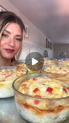 a woman is looking at some food on the counter and she is making it look like she's ready to bake