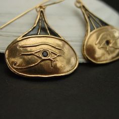 Hand carved ancient Egypt eye of Horus earrings.The Eye of Horus is an ancient Egyptian symbol of protection, royal power, and good health. The Eye of Horus is similar to the Eye of Ra, which belongs to a different god, Ra, but represents many of the same concepts.The eye of Horus was often used to symbolise sacrifice, healing, restoration, and protection.Funerary amulets were often made in the shape of the Eye of Horus. The symbol "was intended to protect the pharaoh in the afterlife" and to wa Egypt Eye, The Eye Of Ra, Egyptian Earrings, Ancient Egyptian Jewelry, Ancient Egyptian Symbols, Sapphire Eyes, Eye Of Ra, Egyptian Symbols, Egyptian Jewelry