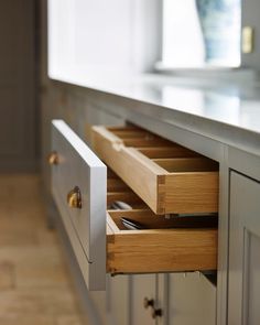 the drawers are open and ready to be used in the kitchen or dining room area