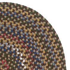 a multicolored rug is shown in the shape of an oval, with different colors and sizes