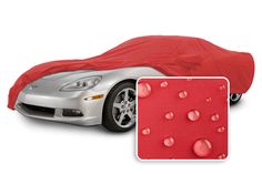 a car covered in a red cloth with water drops