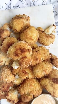 fried food with dipping sauce on the side