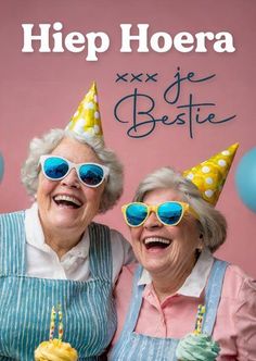 two older women wearing party hats and sunglasses