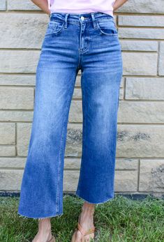 The Olivia High Rise Wide Crop Jeans are sure to be your new favorite! These jeans have the comfort stretch we all love and a raw hem which makes it customizable for your desired length. This style looks great in the summer with flats or sneakers and in the winter with booties. Get a pair of these versatile jeans before they're gone! Washed finish High Rise 9" Wide Leg Opening 10" Ankle Crop Length 26.5" Raw Hem Comfort Stretch 94% Cotton/ 5% Polyester/ 1% Spandex Machine Wash Cold Color: Medium Style Looks, Boyfriend Style, Eco Friendly Fashion, Local Boutique, Crop Jeans, Boutique Brands, All Love, In The Winter, Ankle Jeans