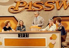 five people sitting at a desk in front of a sign that says passaway on it