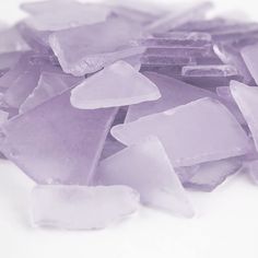 a pile of ice cubes sitting on top of a white table