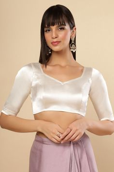 Item Type: Saree Blouse / Crop top Product Features: Color: Off White Fabric: Satin Cotton Stretchable Fabric - Stretches 1-2 sizes Neck Style: Pentagon Sleeve Length: Half Sleeve Disclaimer: There will be slight difference in digital to actual image White Long Sleeve Blouse For Saree, White Satin Blouse For Saree, Formal Long Sleeve Unstitched Blouse, Fitted Feminine Solid Blouse, White Self-design Georgette Blouse Piece, Fitted Padded Blouse Top For Wedding, White Fitted Long Sleeve Blouse, Wedding Unstitched Blouse Tops, Fitted White Padded Blouse Piece