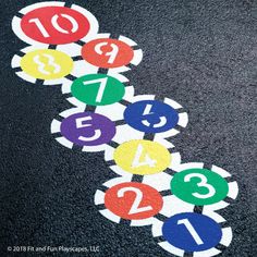 the numbers are arranged in different colors on the ground with black background and white border