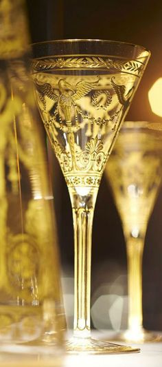 two champagne glasses sitting next to each other on a table