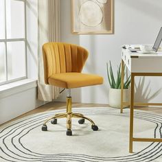 a yellow chair sits in front of a white rug