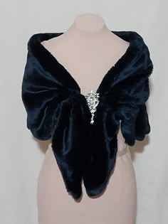 This elegant dark blue faux fur capelet was designed for that special day or evening wedding. The design of this capelet is elbow length. (Measures Approx 18" , Will Fit Up To 45 inch circumference (Fits Small -Plus size)  Since every garment is created  for you-  For best accurate results, measure yourself& compare with the detailed size chart below:  fur capelet with bow closure length                        small          40 in medium     43 in large          47 in INSTRUCTIONS WHEN ORDERING: Fur Capelet, Navy Shawl, Blue Winter Wedding, The Empyrean, Cape Designs, Fairytale Fashion, Blue Clothing, Dark Blue Dress, Blue Winter