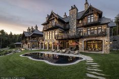 a large house with a pool in the front yard