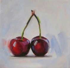 two cherries sitting on top of each other