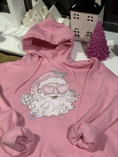 New and trendy hoodie sweatshirt  Size M Pink color  printed Pink Disco Santa Clause Pink Hooded Casual Sweater, Casual Pink Hooded Sweater, Casual Pink Hoodie Sweater, Casual Pink Fleece Sweater, Casual Pink Sweater With Drawstring Hood, Winter Graphic Print Hooded Top, Winter Hooded Top With Graphic Print, Pink Cozy Fit Casual Sweatshirt, Pink Casual Cozy Fit Sweatshirt