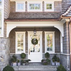 a house with stone steps and white doors