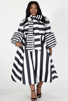 Discover comfort with this Paris chic dress. Detailed with black and white stripes, exaggerated bow tie, ballon sleeved bow and deep pockets. Figure friendly waist shaping complements all body types. You'll find so many ways to wear this versatile easy midi length dress. Model is wearing size 1XL. Runs big. Has minimal stretch Black And White Striped Dress Plus Size, Long Summer Dress Outfits, White Dress Ideas, Church Attire, Chic Plus Size, African Maxi Dresses, Paris Chic, Circle Dress, Plus Size Party Dresses