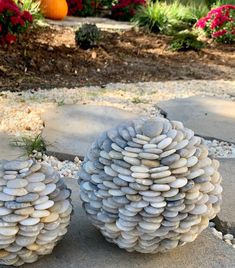 two large rocks sitting on top of a sidewalk