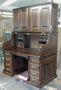 an old fashioned wooden desk in a shop