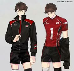 two men in soccer uniforms standing side by side, one wearing black and the other red